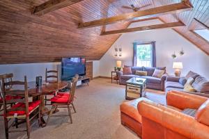 a living room with a couch and a table at Creekside Brevard Home Less Than 1 Mi to Downtown! in Brevard