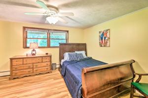 a bedroom with a bed and a ceiling fan at Lovely Richwood Respite Skiing, Biking, Climbing in Richwood