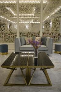 a living room with a couch and a coffee table at Hotel Diamantidis in Myrina