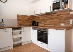 A kitchen or kitchenette at Apart welcom