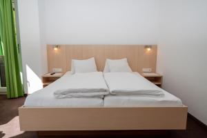 A bed or beds in a room at Apart welcom