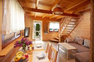 a living room with a table with fruit on it at Morska Mila in Gąski