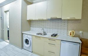 Η κουζίνα ή μικρή κουζίνα στο Happy Stay