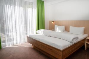 A bed or beds in a room at Apart welcom