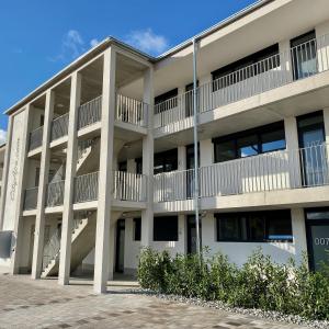 an apartment building with balconies on the side of it at City Apartments Kaiserslautern in Kaiserslautern
