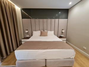Letto o letti in una camera di Hotel Aross