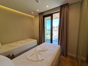 Letto o letti in una camera di Hotel Aross