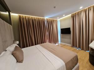 Letto o letti in una camera di Hotel Aross