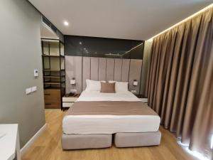 Letto o letti in una camera di Hotel Aross