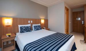 Postel nebo postele na pokoji v ubytování Hotel Atlântico Rio