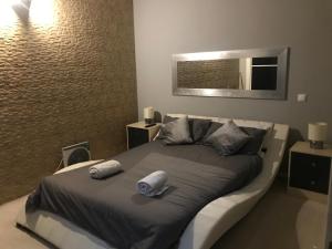 a hotel room with a bed and a television at casa 42 in Barão de São João