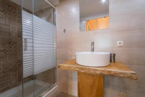 a bathroom with a sink and a shower at Luca Mare in Gouvia