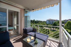 Balkón nebo terasa v ubytování Lakeside Family Apartment