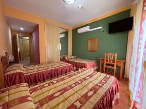 Łóżko lub łóżka w pokoju w obiekcie Quéntar Hotel Rural