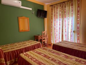 Łóżko lub łóżka w pokoju w obiekcie Quéntar Hotel Rural