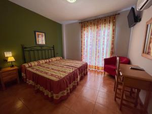 Łóżko lub łóżka w pokoju w obiekcie Quéntar Hotel Rural