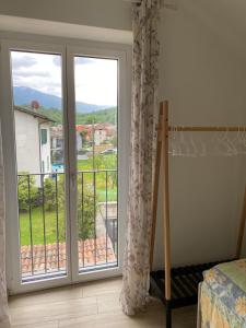 Postel nebo postele na pokoji v ubytování Losone - Locarno, Rustico San Giorgio