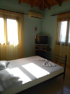 Postel nebo postele na pokoji v ubytování Janis Castle Apartment