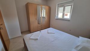 Postel nebo postele na pokoji v ubytování Apartments Margita
