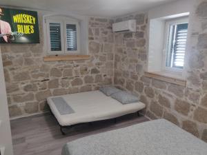 Postel nebo postele na pokoji v ubytování Split Stone