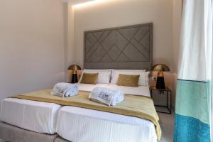 BiBo Suites Real Chancilleria客房内的一张或多张床位