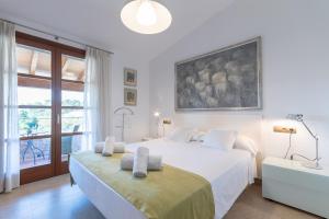 Postel nebo postele na pokoji v ubytování Es Flavo + 21 fotografií