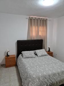 Voodi või voodid majutusasutuse Impeccable 2-Bed House in Guia de Isora toas