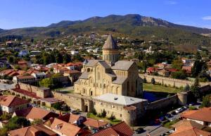 an aerial view of an old building in a city at Hotel ULYSSES in Mtskheta