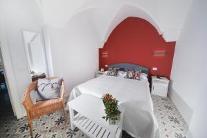 Postel nebo postele na pokoji v ubytování Dimora D'Erchia Apulian Holidays