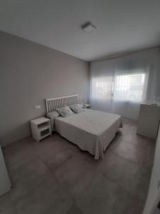 Postel nebo postele na pokoji v ubytování Casa Les Buganvilles
