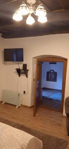 A television and/or entertainment centre at Kiscsermely Vendégház