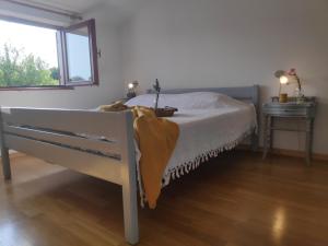 Postel nebo postele na pokoji v ubytování Apartment Soline