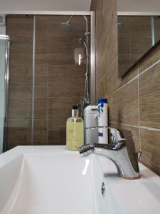 a bathroom with a sink and a mirror at ZAHRA ARAGONA in Aragona +53 photos