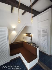 a small room with a bed in the attic at Tiny Circe house - alloggio turistico in San Felice Circeo