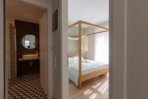 A bed or beds in a room at Two Olive Trees - Deluxe Apartments