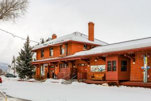 a large brick building with snow on the ground at Dulany 104 in Steamboat Springs