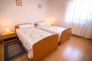 Postel nebo postele na pokoji v ubytování Apartment Marcella