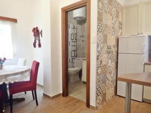 a kitchen with a dining table and a refrigerator at Holiday home in Starigrad-Paklenica 40978 in Starigrad-Paklenica +26 photos
