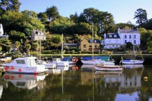 a group of boats docked in a body of water at Domaine De Kerstinec/Kerland in Riec-sur-Bélon