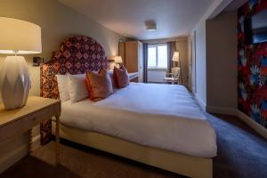 Llit o llits en una habitació de The Smugglers Inn