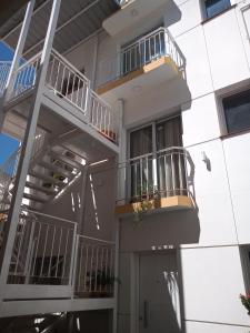 a building with balconies on the side of it at Brisas del Parque II in Salta