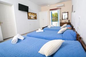 A bed or beds in a room at Gardenia Hotel