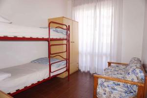 Кровать или кровати в номере Holiday home Porto Santa Margherita 40283