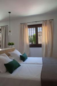 Ένα ή περισσότερα κρεβάτια σε δωμάτιο στο Apartamentos Tres Llaves Palacio de Vela de los Cobos