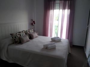 Tempat tidur dalam kamar di La Carbonera