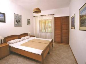 Postel nebo postele na pokoji v ubytování Apartment in Njivice - Insel Krk 38752