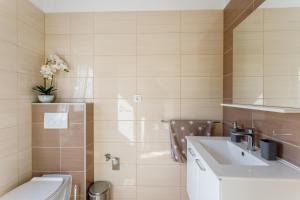 a bathroom with a sink and a toilet at Luxury apartments Budimir in Podstrana +72 photos