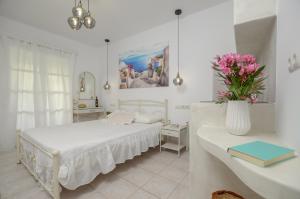 Ένα ή περισσότερα κρεβάτια σε δωμάτιο στο simos luxury apartments