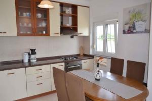 Kuchyň nebo kuchyňský kout v ubytování Apartment in Umag - Istrien 36919