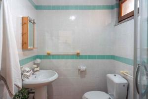 a bathroom with a toilet and a sink at Holiday home in Santa Teresa di Gallura 27331 in Santa Teresa Gallura